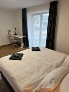 Postel nebo postele na pokoji v ubytování WOODLAND apartment and sauna