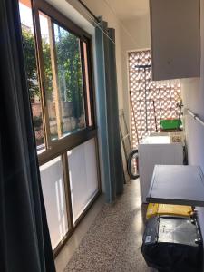 a room with a large window in a room at Via Clitunno 24 in Foligno
