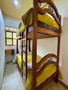 a bedroom with bunk beds in a house at Qushi Shoncu Lodge in Huaylas +17 photos