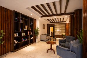 a living room with a couch and chairs and a table at Alt Life Luxe - Uppper Bhagsu Mcleodganj in McLeod Ganj