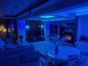 a living room with a table and a couch at Luxury central in Craiova