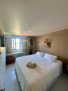 Ένα ή περισσότερα κρεβάτια σε δωμάτιο στο Apartamento amplo e equipado, entre a praia e o centro +18 φωτογραφίες