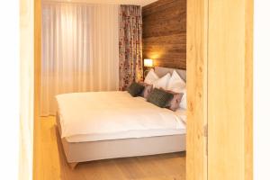 Postel nebo postele na pokoji v ubytování Terra Alpina