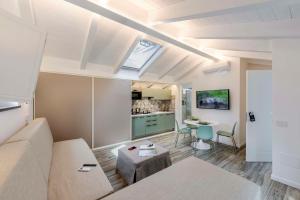 a living room with a couch and a table at Agave Apartment in Vico Equense