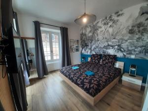 Ένα ή περισσότερα κρεβάτια σε δωμάτιο στο Le canon des remparts