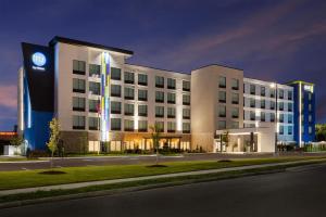 a building with a clock on the side of it at Home2 Suites By Hilton Cleveland, TN in Cleveland