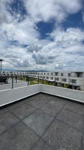 a large apartment building with a patio with a view of the ocean at House Alto 58 Xochitepec Morelos in Xochitepec
