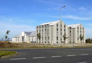 a large white building on the side of a road at ARGENTIA noclegi in Dzierżoniów