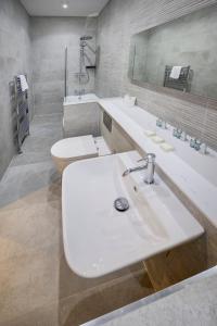 a bathroom with a white sink and a toilet at New Town Hotel in Edinburgh