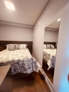 Postel nebo postele na pokoji v ubytování Allianz Vila Romana