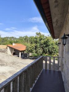 a view from the porch of a house with a building at Oak House in São João do Monte
