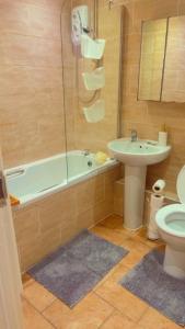 Koupelna v ubytování Maxismile Rooms