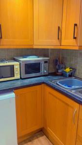 Kuchyň nebo kuchyňský kout v ubytování Maxismile Rooms