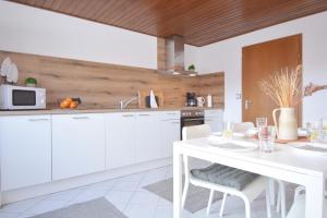 Kuchyň nebo kuchyňský kout v ubytování Gun01 + 31 fotografií