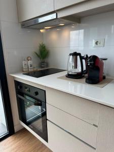 Una cocina o kitchenette en More deluxe sol 25 fotos más