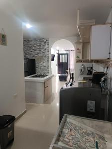 a kitchen with a stove and a counter top at Apto San José in Armenia