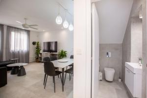 a kitchen and living room with a table and chairs at Two Bedroom House In Town Center by Sweet Keys in Limassol