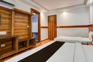 Ένα ή περισσότερα κρεβάτια σε δωμάτιο στο Townhouse Railway Road Katra Formerly The Amro