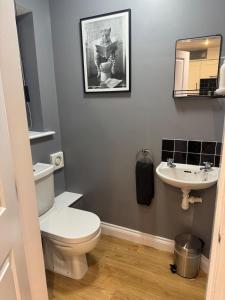 a bathroom with a toilet and a sink at Willow Cottage in North Muskham +46 photos
