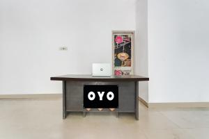 a table with an ovy sign on it at SPOT ON Gorav Smark in Malhour