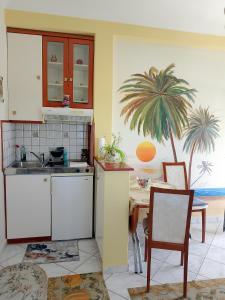 Kuchyň nebo kuchyňský kout v ubytování Sea View Nest