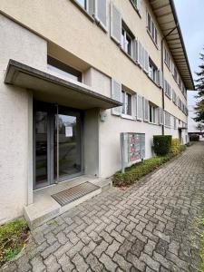 a building with a door on the side of it at Live Zurich in Cozy Apartment in Zürich
