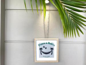 a picture of a happy face hanging on a wall at Paws n Relax- Pet friendly, walk to off leash beach and cafes in Port Macquarie