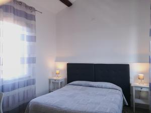 Postel nebo postele na pokoji v ubytování Corte Loredana