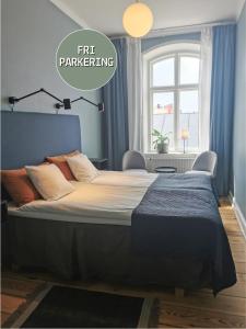 a bedroom with a large bed with the words rendering at Hotell Fängelset Västervik in Västervik