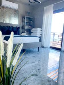 a bedroom with a bed and a glass floor at Entire home for 2 with private pool and plenty of amenities in Rio Grande, Puerto Rico in Rio Grande