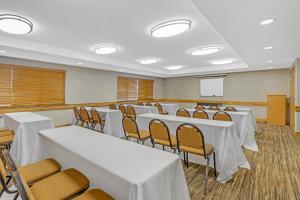 a conference room with tables and chairs and a screen at Best Western Plus McCall Lodge and Suites in McCall +61 photos