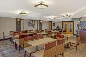 a dining room with wooden tables and chairs at Best Western Plus McCall Lodge and Suites in McCall