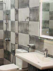 a bathroom with a sink and a toilet and a mirror at Villa southern coast in Kamburugamuwa +46 photos