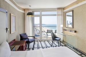 a hotel room with a view of the ocean at Renaissance Tel Aviv Hotel in Tel Aviv