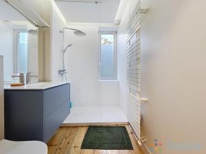 a bathroom with a shower and a sink at Anavel Atao in Lille
