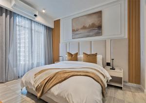 a bedroom with a large bed and a large window at MNM Luxury Suit 424A in Pretoria +35 photos