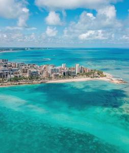 an aerial view of a beach in the ocean at Pousada Maré Alta Pajuçara in Maceió