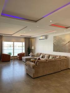 a living room with two couches and a couch at شاليه مارفن درة العروس البرادايس in Durat  Alarous