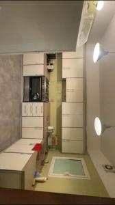 a kitchen with white cabinets and a sink in it at شاليه مارفن درة العروس البرادايس in Durat  Alarous