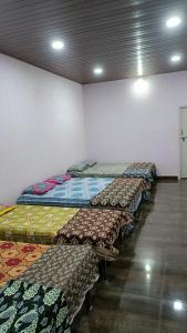 Postel nebo postele na pokoji v ubytování Baada Beach VT stay + 7 fotografií