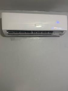 a microwave oven sitting on top of a refrigerator at Guest house 7 mins From stadium in Opa-locka +2 photos