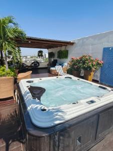 a hot tub on the roof of a house at Condominio Panamá in Puerto Vallarta