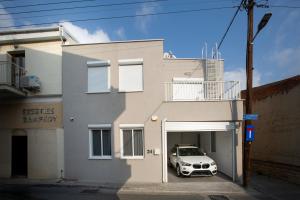 a car parked in a garage in front of a building at Two Bedroom House In Town Center by Sweet Keys in Limassol
