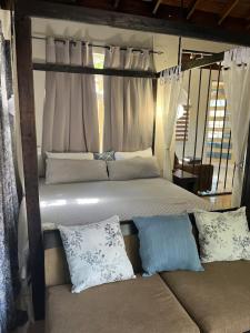 Postel nebo postele na pokoji v ubytování Blessed Villas and Resort