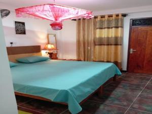 Ένα ή περισσότερα κρεβάτια σε δωμάτιο στο Princess Villa Kandy Rail Station