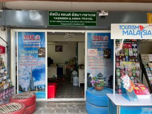 a store with signs in the doorway of a store at Banhor Residence in Chiang Mai