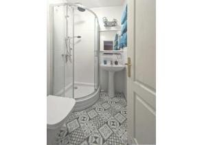 a bathroom with a shower and a toilet and a sink at FLORIAN - tuż przy plaży in Mielno +21 photos