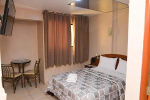 Ένα ή περισσότερα κρεβάτια σε δωμάτιο στο hotel opera