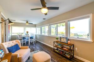 a living room with a couch and a table at Wilson Waterfront Getaway Near Hikes and Wineries! in Wilson