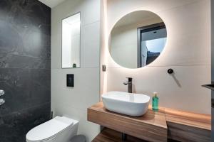 a bathroom with a sink and a mirror at Luxury Villa Helena, with heated pool in Makarska +41 photos